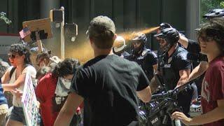 Two arrested after protesters clash with police in uptown Charlotte