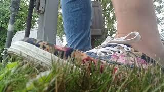 In the garden jeans and flower shoes pee