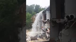Flood waters pour through West Virginia apartment, tears off wall