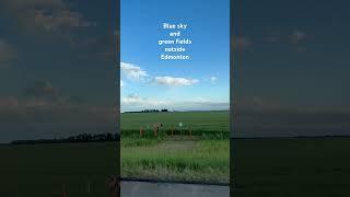 Blue skies and green fields outside Edmonton