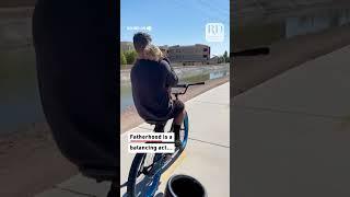 This dad had to not only pedal his bike, but rub his toddler's back while doing so! #cutetoddler