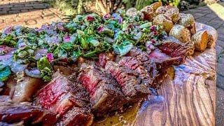 The best meat cooked on a tree stump with chimichurri sauce.