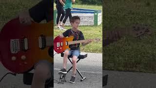 3rd grade talent show - Playing Seven Nation Army by White Stripes solo on the guitar