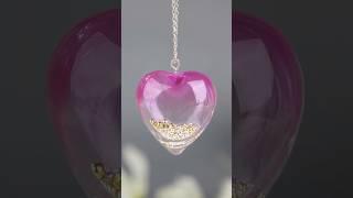  Heart-shaped UV resin pendant with shimmering gold and silver beads, making every detail sparkle!