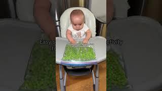The easiest sensory activity for your babe! Literally just frozen peas and water in a ziploc  You co