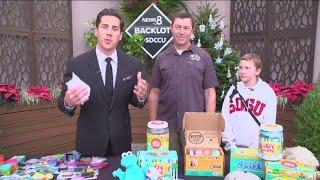 Mike Hess and daughter Keely holding toy drive to bring joy to kids fighting cancer