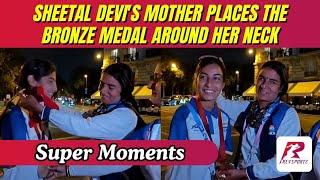 A heartwarming moment as Sheetal Devi's mother places the bronze medal around her neck