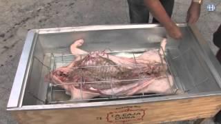 How to roast a whole pig in a Caja China