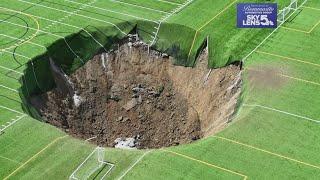 Surveillance video shows moment when 100-foot-wide sinkhole swallows Alton, Illinois soccer field