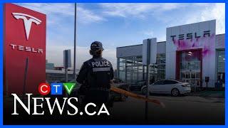 Tesla dealership painted by protesters