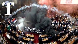 Smoke grenades thrown in Serbian parliament by angry opposition MPs