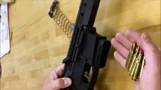 Unloading a MassReloading fixed-magazine AR-15 style rifle.