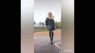 crossdresser in the rain in thigh high boots and black leather outfit #sissy #heels #leather