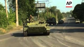 Armoured vehicles driven by pro-Russia rebels drive towards Krasnodon