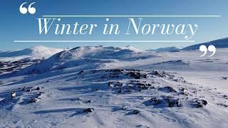 Flying above a beautiful snow-clad landscape in Norway - 4K drone movie