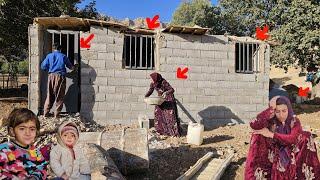 Installation of doors and windows in Khadija's cottage by a construction master