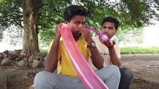 Indian man uses ears to inflate balloons in weird trick