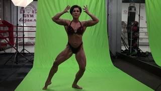 Front double biceps. IFBB Women's Physique Mandatory poses by NATALIA BYSTROVA.