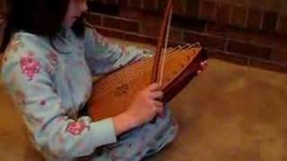 Ema Playing Bowed Psaltery