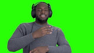 Man in headphones dancing on green screen - Chroma key no Copyright