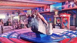 Pretty Girl in Beautiful Dress Riding on a Bull in Benidorm | Mechanical Bull 4K. Epic Fail August