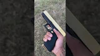 ONE HAND GOLD GLOCK 50 gi SHOT!!