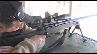 Accuracy International AI rifle with suppressor