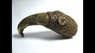 Saxon gold treasure as found gold ring and  gold raven head