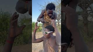 Hadzabe Tribe bushmen brothers Dudukwe and Chabba help each other with everything 
