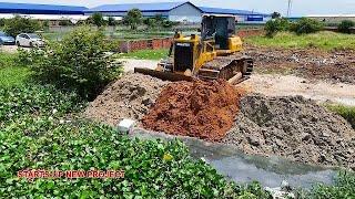 Amazing power bulldozer starts pushing new project landfill with dump trucks