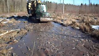 John Deere 1110D logging in mud, big load