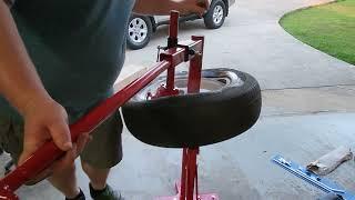 Harbor Freight manual tire changer with duckbill attachment. Mounting a trailer tire.