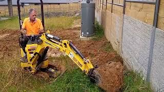 Mini Excavation - Yanmar SV-08 and Yanmar C10R dumper, levelling around new house in the mud.