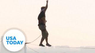 Estonian man slacklines across bridge connecting Asia to Europe | USA TODAY