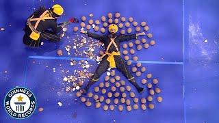 Most Coconuts Smashed Around A Person Whilst Blindfolded - Guinness World Records