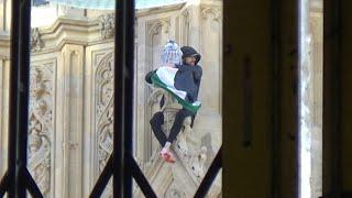 Man with a Palestinian flag perches on the side of Big Ben tower | AFP