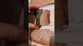 How to hang a picture from a brick wall without power tools or modifying the wall