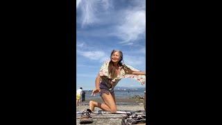 Granny doing yoga after ocean swim