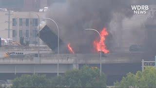 Driver escapes before semi crashes, falls in flames from I-65 in downtown Louisville