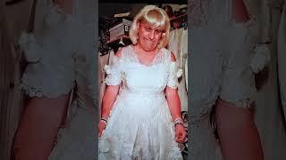 Wendy wearing a white satin wedding dress