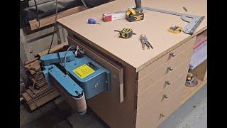 Fitting my bench sander onto a folding shelf.