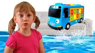 Alena and Pasha play with toy Minibus and save it from water