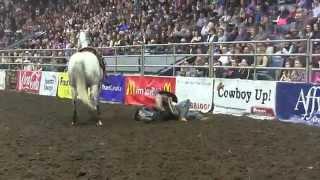 Wreck: Wyatt Thurston pulls Wade Rempel off his horse (CCA) Finals 2014 Day 4