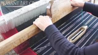 Romanian Woman Demonstrates Weaving a Traditional Skirt