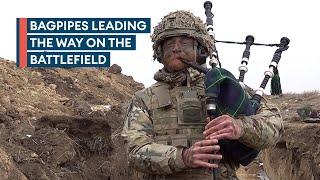 Highlanders piper performs in the trenches during Exercise Steadfast Dart