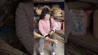 Female craftsman making sorghum broom