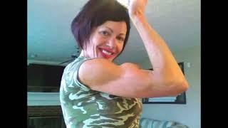 Mistress Debbie Flexing Biceps