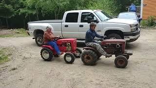 BBT on her Pigpen tractor hauling the Momma on a Pony tractor to it's new temporary home.