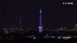 Berlin Syline at night seen from "Teufelsberg" in forest Grunewald