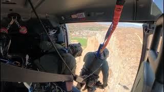 Hoist rescue of rock climber with a broken rope.